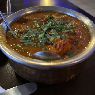 a bowl of soup with a spoon in it