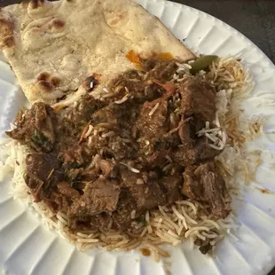Goat Curry, rice, and Garlic Naan.