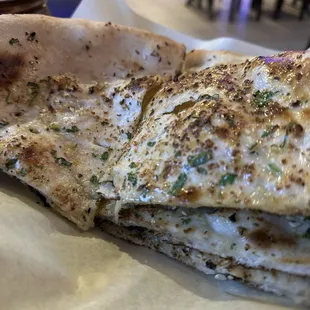 a close up of a piece of flat bread