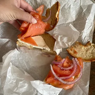 a sandwich with salmon and onions