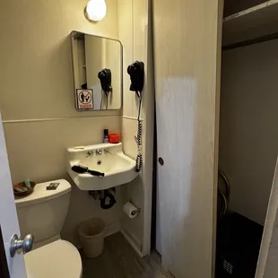 Door was off the rails and couldn't be moved or budged...shower had a ear piercing sound, and toilet kept making a constant sound