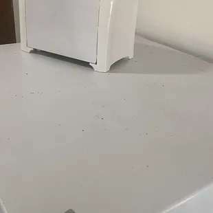 Very dusty top of the fridge.