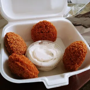 Four meager pieces of dry falafel.