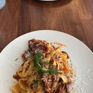 two plates of pasta on a table