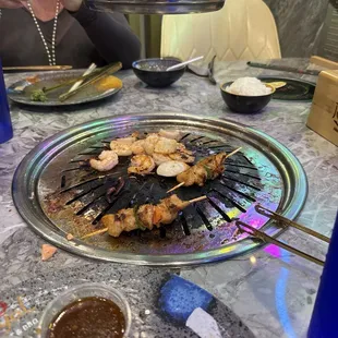 Grilling some chicken skewers and shrimp