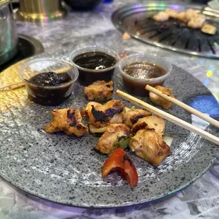 Trying the grilled meats with some of their special sauces