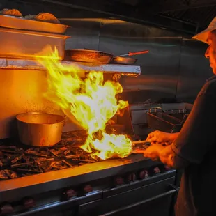 a man cooking in a kitchen