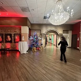 a woman walking through the lobby of a hotel