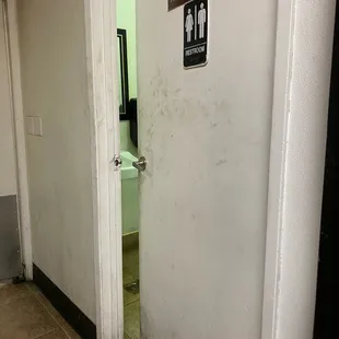 a dirty bathroom door