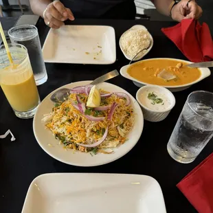 Mango lassi (left), chicken birayni (middle), and Chicken Tikka Masala (right)