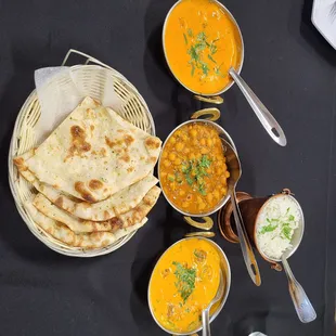 Chicken Tikka Masala, Chana Masala, Malai Kofta, Garlic Naan, and Basmati Rice.