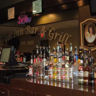 a bar with a lot of liquor bottles