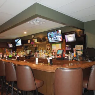 bar seating and televisions