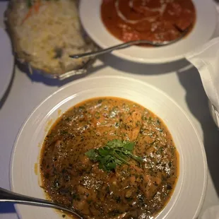 a bowl of soup and a plate of rice