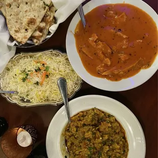 Butter Chicken, Garlic Naan, and Baigan Bharta.