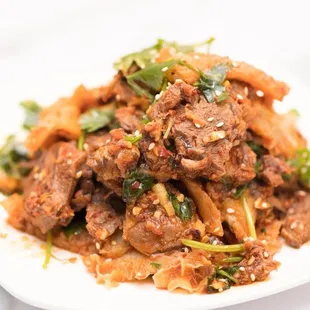a plate of beef and noodles