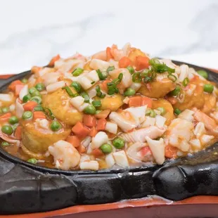 a plate of food with shrimp and vegetables