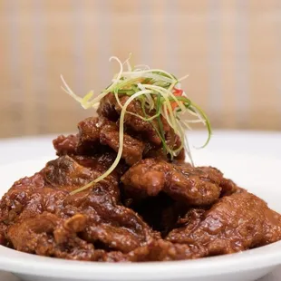 a plate of food with meat and vegetables