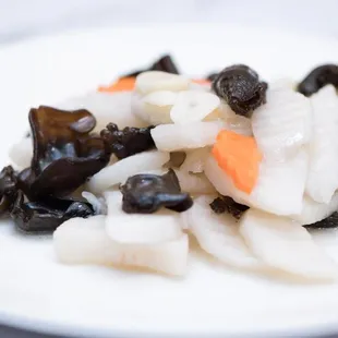 a white plate of food on a table