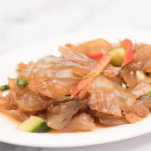 a plate of food with meat and vegetables