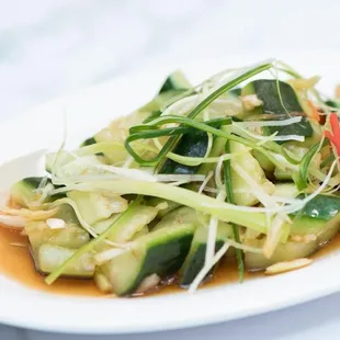 a white plate with a salad on it