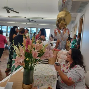 06/01/24 Reception table.  Kitchen just beyond the balloons