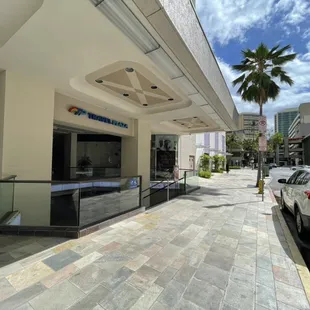 We are on the "ROYAL HAWAIIAN AVE." Side of Waikiki Shopping Plaza! Stairs between Victoria's Secret and ABC