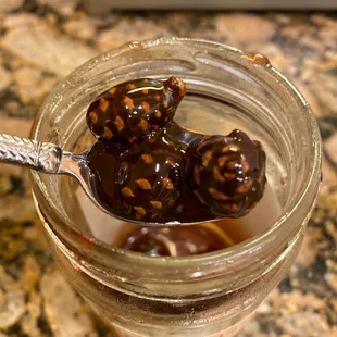 a jar of chocolate covered cherries