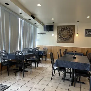 a restaurant with tables and chairs