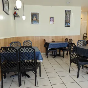 a dining room with tables and chairs