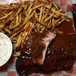 Delicious rib dinner, tender ribs, sauce is awesome, fries and cole slaw