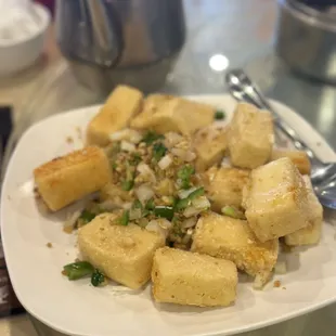 a plate of tofu and rice