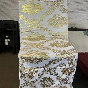 Chairs covers white spandex with gold.