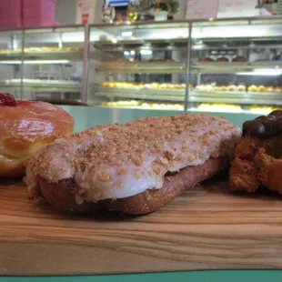 Raspberry Donut, Nuts &amp; cream Donut, and Chocolate topped donut