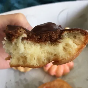 Cross-section of an old-fashioned--nice cakey dough inside and fabulous crisp on the outside, with thick chocolate glaze!
