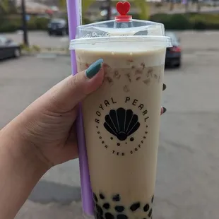 Black milk tea with tapioca pearls, 75% sugar, less ice ($6.14)