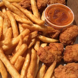 Boneless Chicken Wings came with Fries. It was average carryout fare.