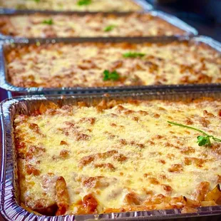four pans of lasagna