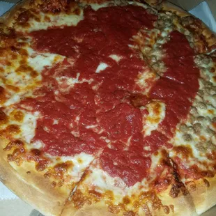 Large half Ground beef half cheese pizza with extra sauce.