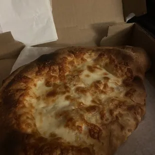 a cheese pizza in a box