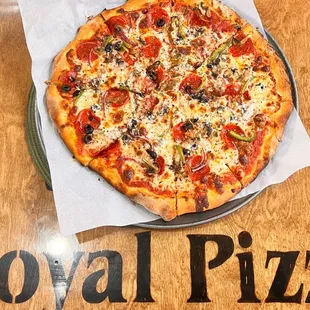 a whole pizza on a plate
