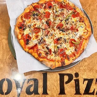 a whole pizza on a plate