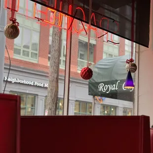 a red neon sign in the window