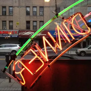 a neon sign that reads dinner