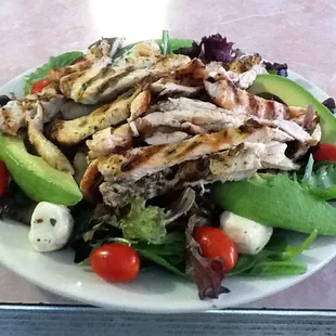 Grilled chicken over portobello salad