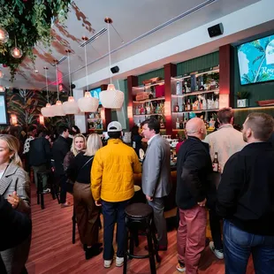 a large group of people at a bar