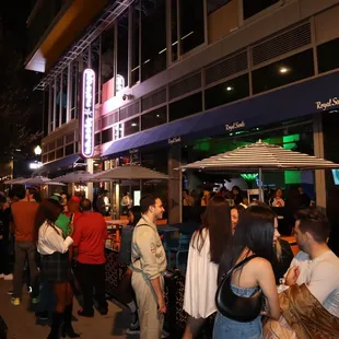 a crowd of people standing outside
