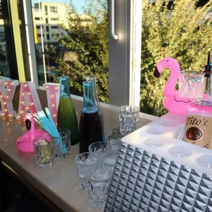 pink flamingo glasses and bottles