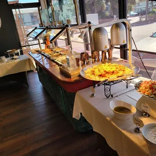 a buffet table with a variety of food