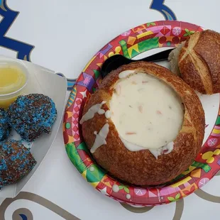 a bowl of soup and a plate of donuts
